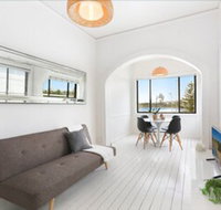 Minimalist Beachfront Apartment - Accommodation Brisbane